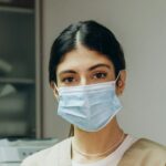 Portrait of female dentist .She standing in her dentist office.