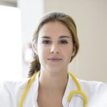 Portrait of female doctor in meeting, differential focus